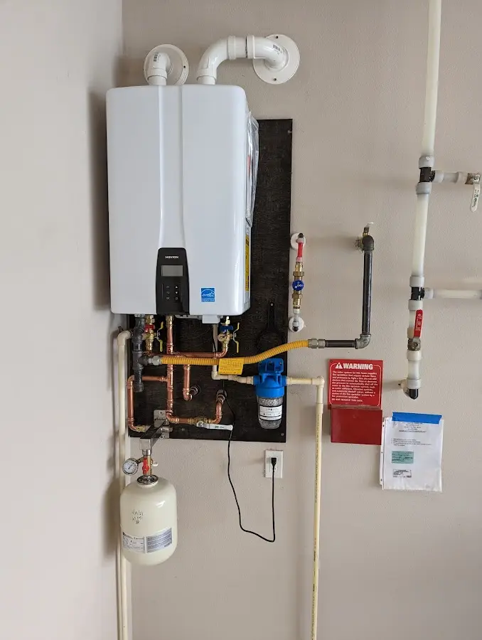 Professional plumber installing copper piping in a Spring Valley Lake home